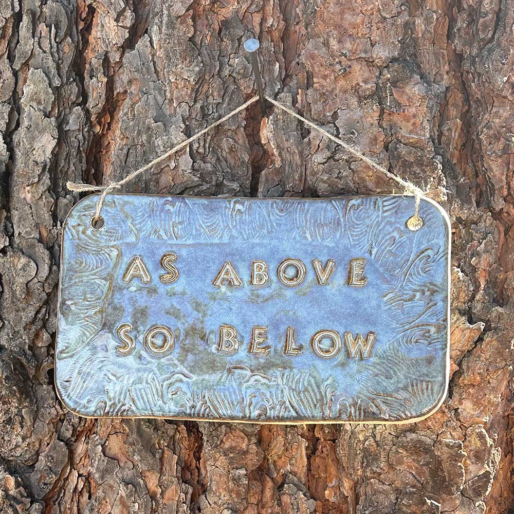 "as above so below" ceramic hanging sign in blue rutile with wave border