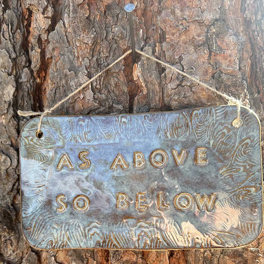 "as above so below" ceramic hanging sign in blue rutile with wave border