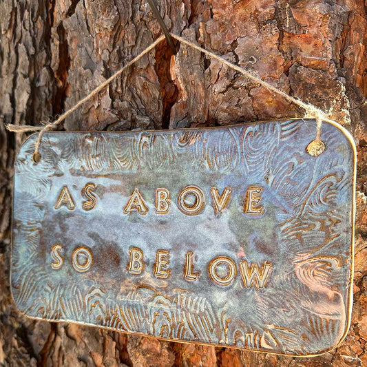 "as above so below" ceramic hanging sign in blue rutile with wave border